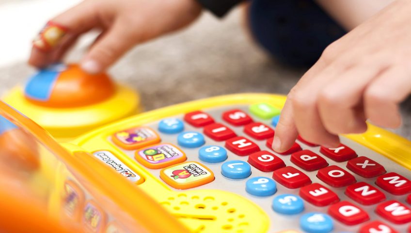 Childs hand on a toy